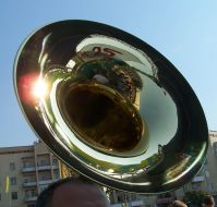 A musician plays on a pipe