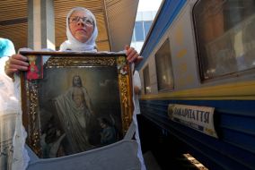 A believer gets an icon on the hips