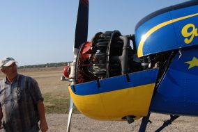 Mechanic checks up airplane Yak-52