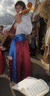 A boy plays on a bandura