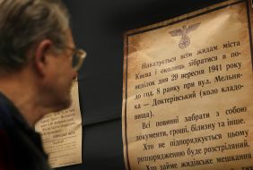 A man reads inscriptions