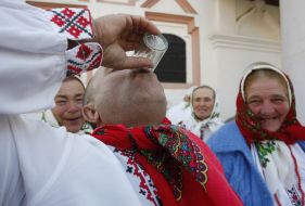 The participant of festival drinks vodka