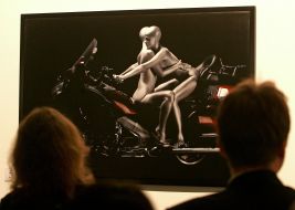 Visitors near a photo with representing naked bikers