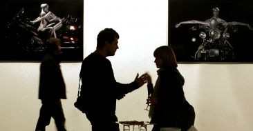 Visitors near a photo with representing naked bikers