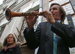 A musician plays on a clarinet