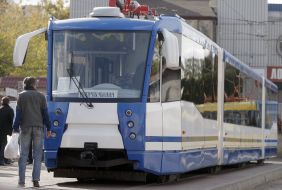 A man goes near tram