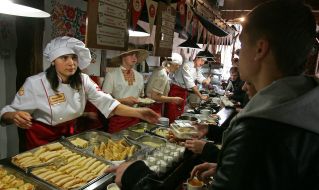 Yevgeniya Kolomurdi serves visitors