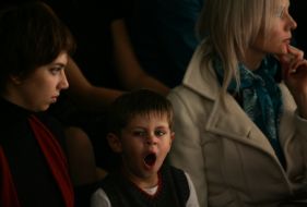 A boy yawns