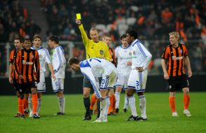 Vladimir Syrenko shows a yellow card