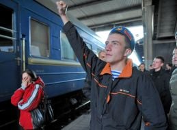 A young man accompanies peacemakers