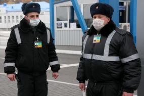 Border guards in respirator masks