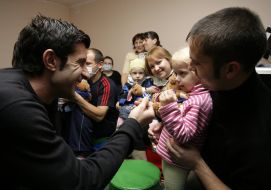 Luis Figo during a visit in a rehabilitation center