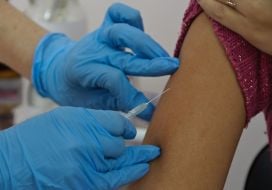 A doctor does a vaccination against a flu