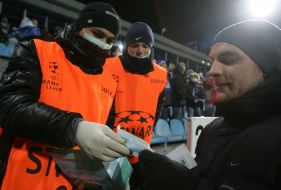 An auxiliary personnel distributes respirators masks