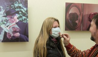 The visitor of exhibition in a respiratory mask