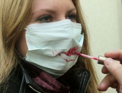 The visitor of exhibition in a respiratory mask