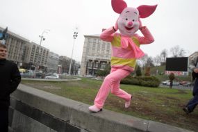 A man in the suit of pig