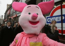 A man in the suit of pig