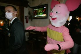 A man in the suit of pig
