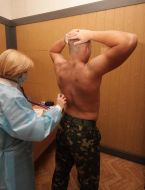 A doctor examines a peacemaker