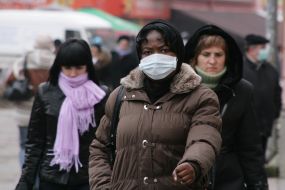 A girl in a respirator mask