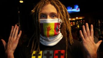 A model in the covered with drawing respirator mask