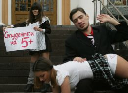 The ”FEMEN” womanish motion activist holds a placard