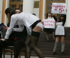 The ”FEMEN” womanish motion activists hold placards