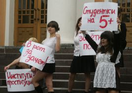 The ”FEMEN” womanish motion activists hold placards