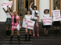 The ”FEMEN” womanish motion activists hold placards