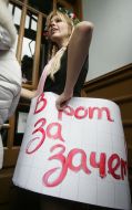 The ”FEMEN” womanish motion activist holds a placard