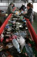 Workers assort garbage