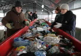Workers assort garbage