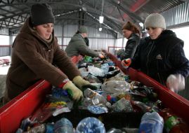Workers assort garbage