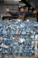 A worker assorts garbage