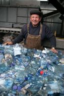 A worker assorts garbage