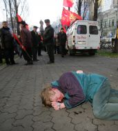 The beaten man lies on earth