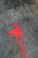 Poured by a red paint monument to Lenin