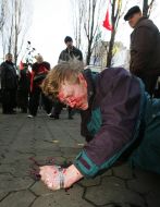 The beaten man lies on earth