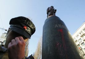 Poured by a red paint monument to Lenin