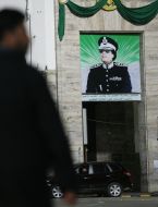 Муамар Каддафи