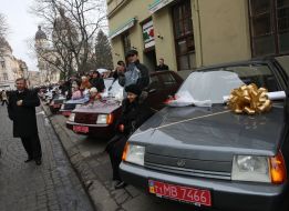 Invalids near the cars complimented with by they