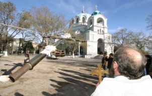 The father Eugen watches after setting of cross