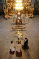 Priests sanctifies a new cross