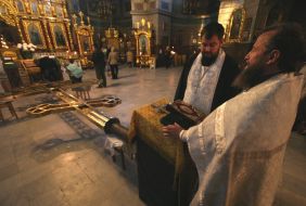 Priests sanctifies a new cross