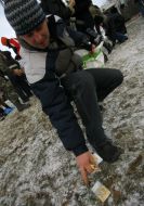 A young man takes money