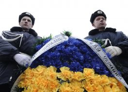 Militiamen hold a memorable chaplet