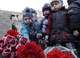 Children lay flowers