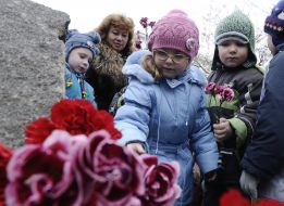 Children lay flowers