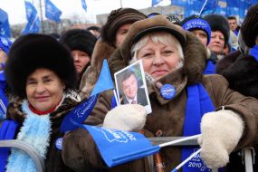 A woman holds the portrait of Viktor Yanukovich
